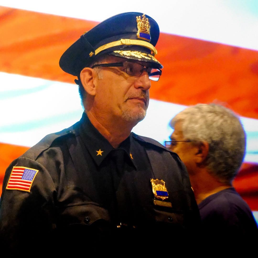A local law-enforcement officer takes part in Kenilworth’s 9/11 remembrance program.