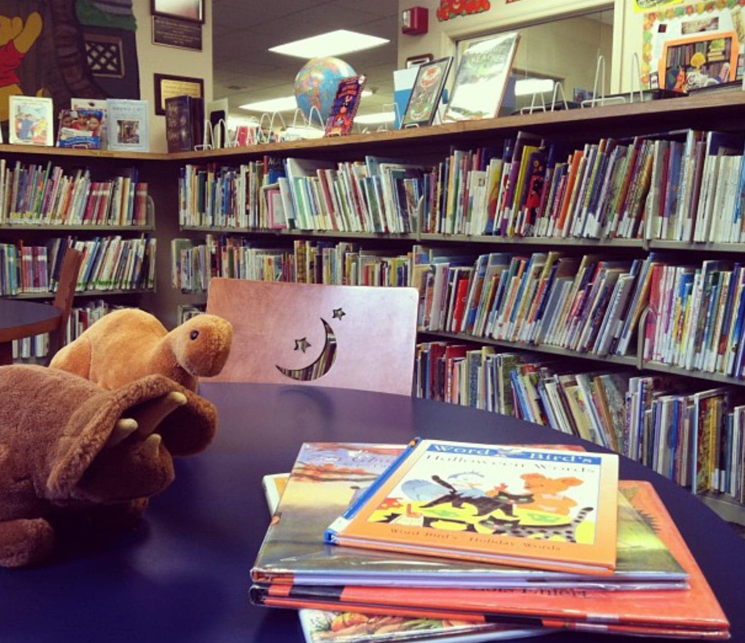 Books await young readers in the library’s children’s area.